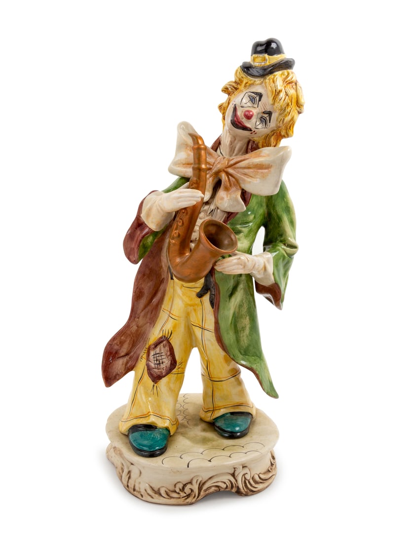 An Italian Ceramic Figure: An Italian Ceramic Figure depicting a clown with a saxophone. Height 22 1/2 inches. This lot is located in Chicago. Provenance Every lot in Sale 6571 - The Vault is being offered as-is and without fur
