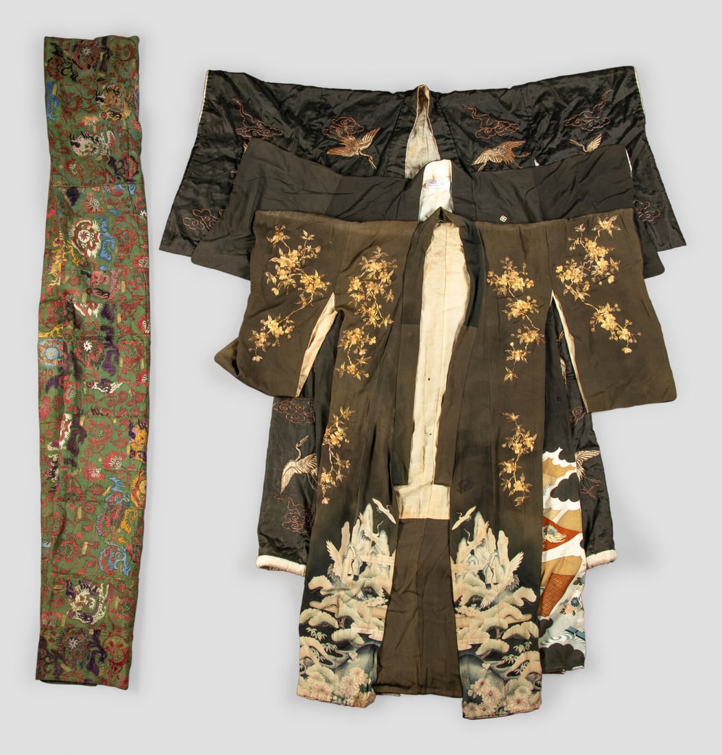 Three Japanese Silk Kimono and One Japanese Silk Priest Robe: Three Japanese Silk Kimono and One Japanese Silk Priest Robe the priest robe embroidered with dragons amongst foliate scrolls against a green ground; the three black-ground silk kimono two embroidered