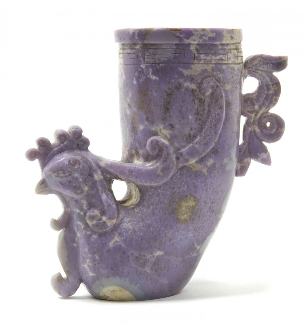 A Carved Lavender Hardstone Wine Cup, Height 4 3/8: A Carved Lavender Hardstone Wine Cup, having a phoenix carved to the exterior, with incised key-fret banding below the mouth rim. Height 4 3/8 inches.