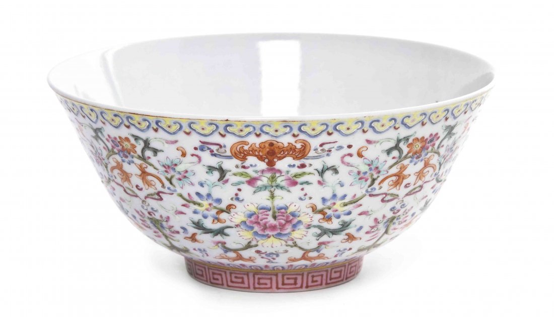 A Chinese Famille Rose Porcelain Bowl, Diameter 5 3/4: A Chinese Famille Rose Porcelain Bowl, having decoration of scrolling flowering plants with iron red bats, with a lingzhi border at the top and a key-fret border above the foot, having an iron red Jia