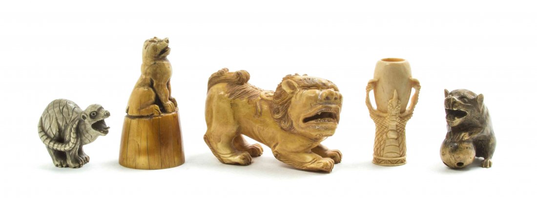 Five Ivory Articles, Width of first 3 inches.: Five Ivory Articles, comprising a fu lion, two netsuke, a seal and a toggle in the form of a claw grasping an ovoid vessel. Width of first 3 inches.