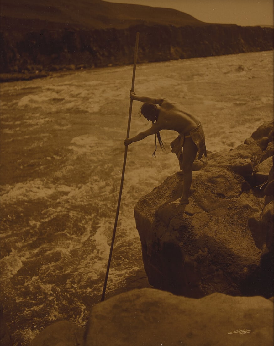 [Native-Americana] Curtis, Edward. The Fisherman-Wishham: [Native-Americana] Curtis, Edward. The Fisherman-Wishham (St. Paul, Minnesota): Christopher Cardoza Fine Art, 2006 (original negative, 1909). Signed in negative "Curtis CCP 2000". Goldtone photograph.