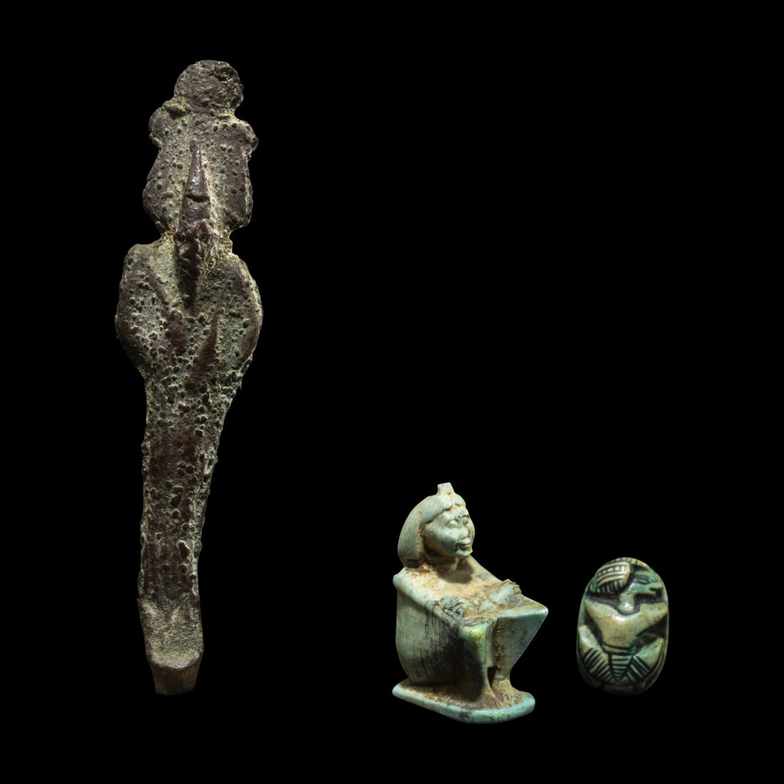 An Egyptian Bronze Osiris, an Egyptian Faience Shu, and an Egyptian Faience Scarab (1 of 4)