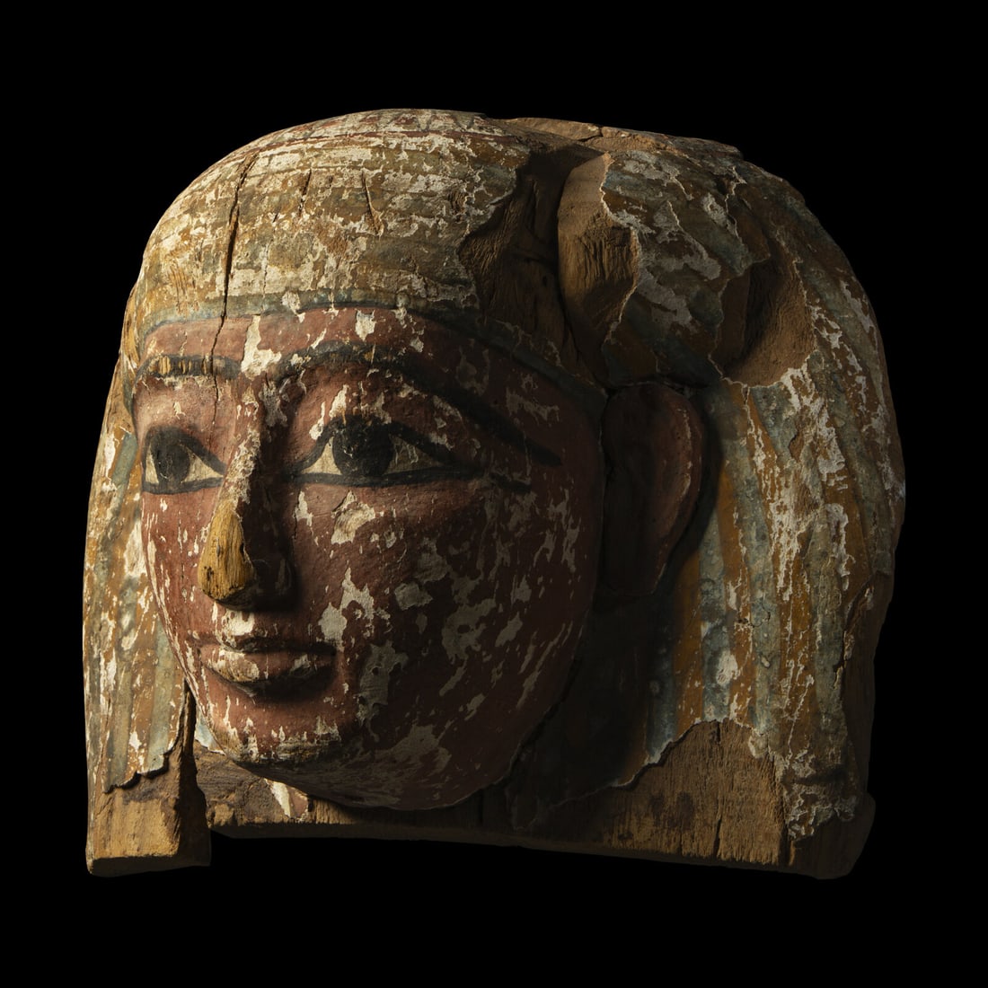 An Egyptian Painted Wood Sarcophagus Head: An Egyptian Painted Wood Sarcophagus Head Late Period, 26th-30th Dynasty, 664-343 B.C. Width 46 cm (18 1/8 inches). Property from a Pennsylvania Collection This lot is located in Chicago. Provenance: 