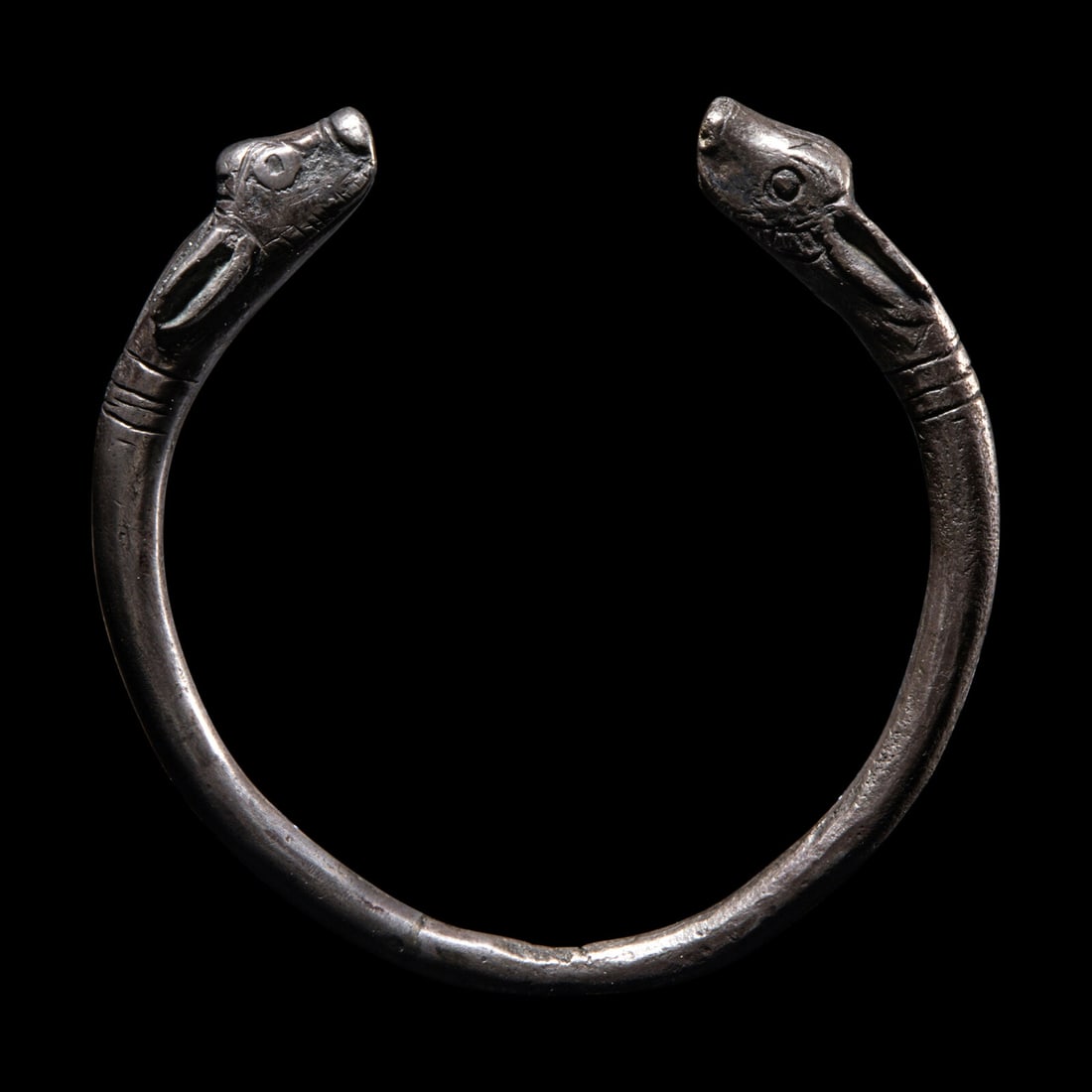 An Achaemenid Silver Bracelet: An Achaemenid Silver Bracelet Circa 6th-5th Century B.C. Height 7.3 cm (2 7/8 inches). This lot is located in Chicago. Provenance: Private Collection (J.B), Switzerland, acquired in the 1960s-1970s. C