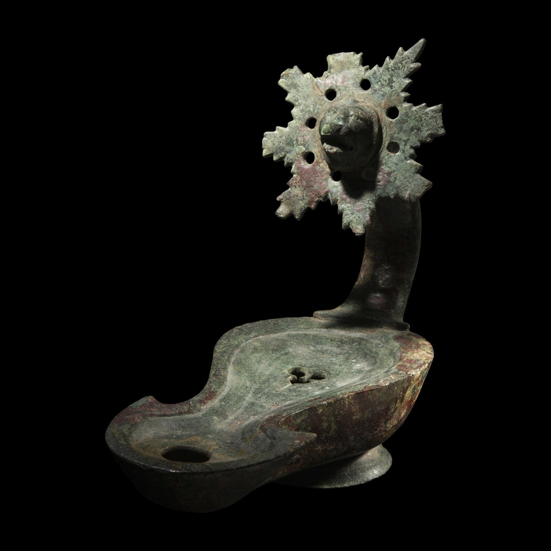 A Roman Bronze Oil Lamp: A Roman Bronze Oil Lamp Circa 1st Century B.C.-1st Century A.D. Length 26.5 cm (10 1/2 inches). This lot is located in Chicago. Provenance: Sotheby's, New York, Antiquities, 8 June 1994, Lot 178. Gera
