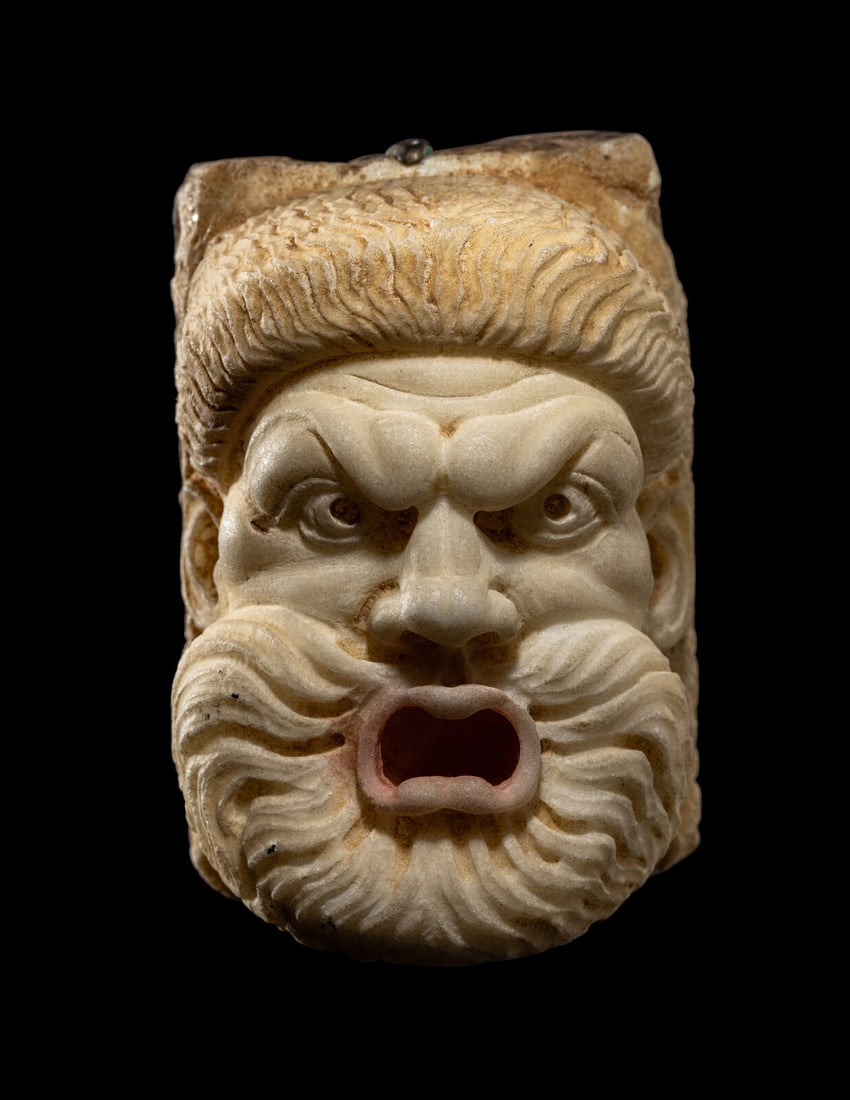 A Roman Marble Theater Mask: A Roman Marble Theater Mask Circa 2nd Century A.D. Height 8 cm (3 1/8 inches). This lot is located in Chicago. Provenance: Merrin Gallery, New York, prior to 1999. Private Estate, Cleveland, Ohio, acq