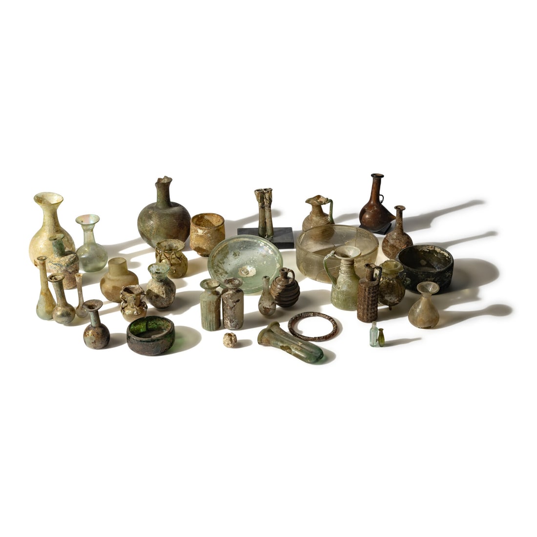 43 Roman Glass Vessels and Fragments: 43 Roman Glass Vessels and Fragments Circa 1st-5th Century A.D. and Later Diameter of largest 16.5 cm (6 1/2 inches). Property from a California Private Collection This lot is located in Chicago. Prov