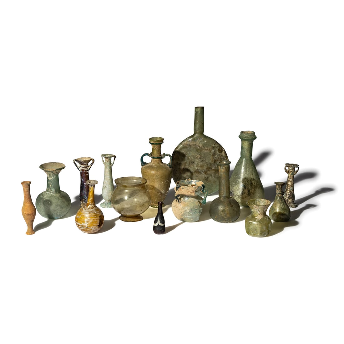 Fifteen Roman and Islamic Glass and Terracotta Vessels: Fifteen Roman and Islamic Glass and Terracotta Vessels Circa 1st-9th Century A.D. Height of largest 24 cm (9 1/2 inches). Property from a California Private Collection This lot is located in Chicago. 