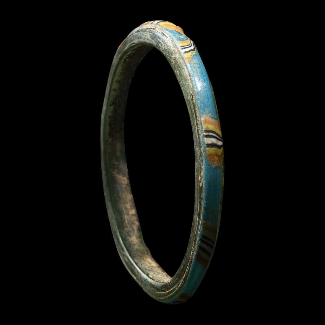 A Roman Glass Bracelet: A Roman Glass Bracelet Circa 1st-3rd Century A.D. Diameter 8.2 cm (3 1/4 inches). This lot is located in Chicago. Provenance: Jan Mitchell (former Trustee of the Metropolitan Museum of Art), New York,