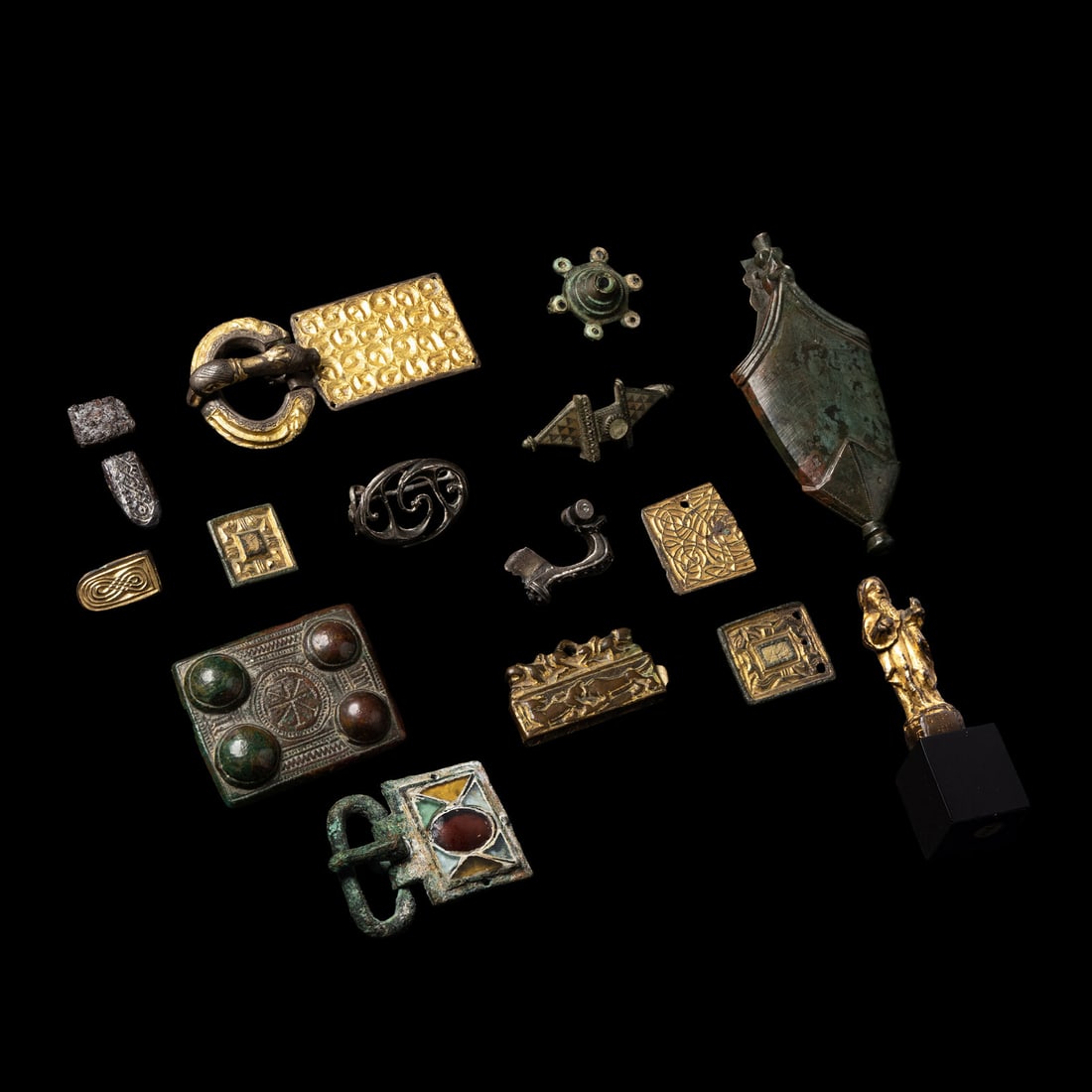 Fifteen Roman and Migration Period Fragmentary Gold, Silver, Enamel and Bronze Fibulae, Fittings,: Fifteen Roman and Migration Period Fragmentary Gold, Silver, Enamel and Bronze Fibulae, Fittings, and a Chape Circa 5th-8th Century A.D. Height of largest 10 cm (4 inches). This lot is located in Chic