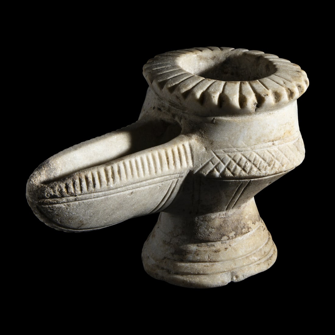 An Islamic Marble Oil Lamp: An Islamic Marble Oil Lamp Circa 1000-1500 A.D. Length 16.5 cm (6 1/2 inches). Property of a California Collector This lot is located in Chicago. Provenance:Private Collection, Ventura County, Califor