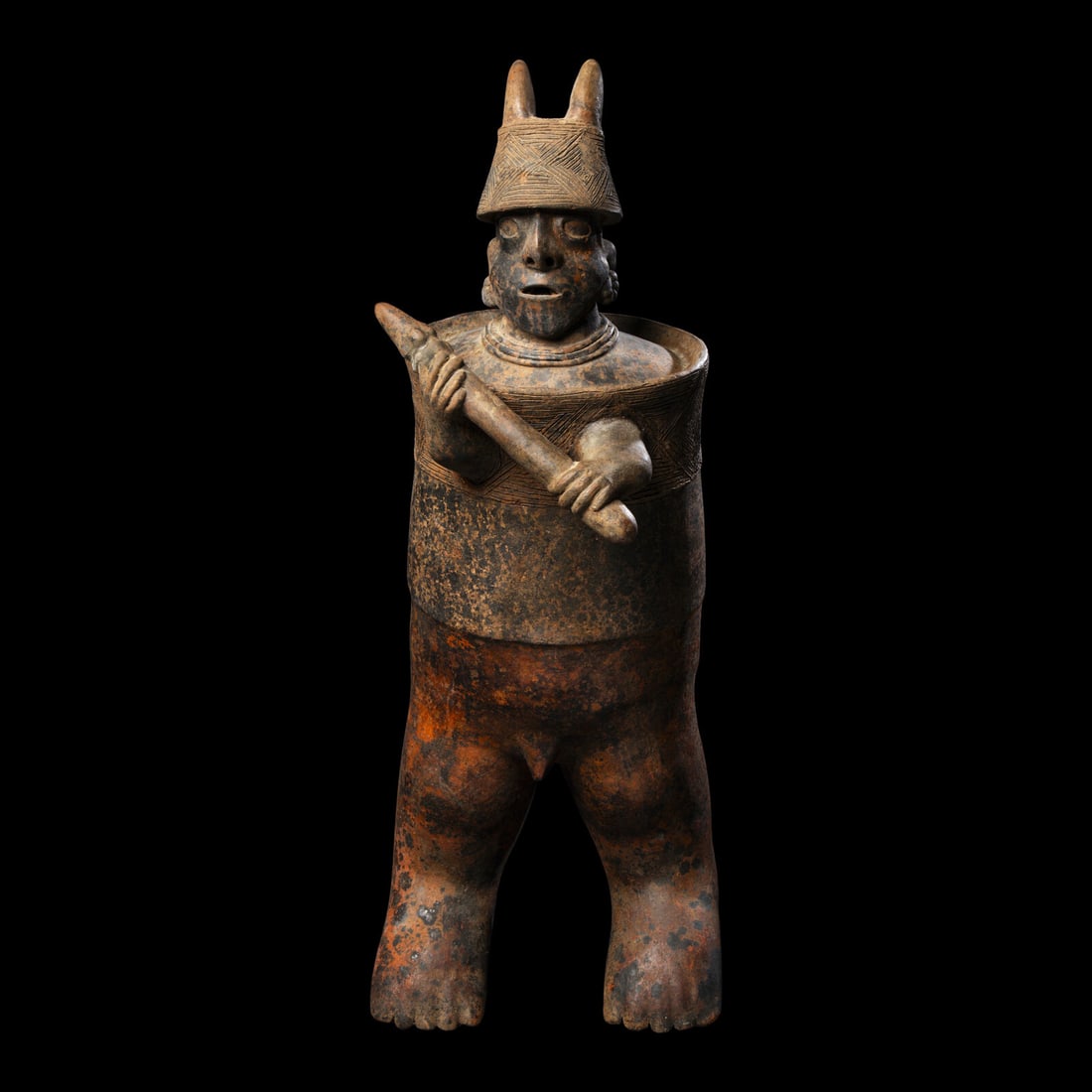 A Nayarit Terracotta Standing Warrior: A Nayarit Terracotta Standing Warrior West Mexico, Circa 1st Century B.C.-2nd Century A.D. Height 65 cm (25 5/8 inches). This lot is located in Chicago. Provenance: The Lands Beyond, New York. David