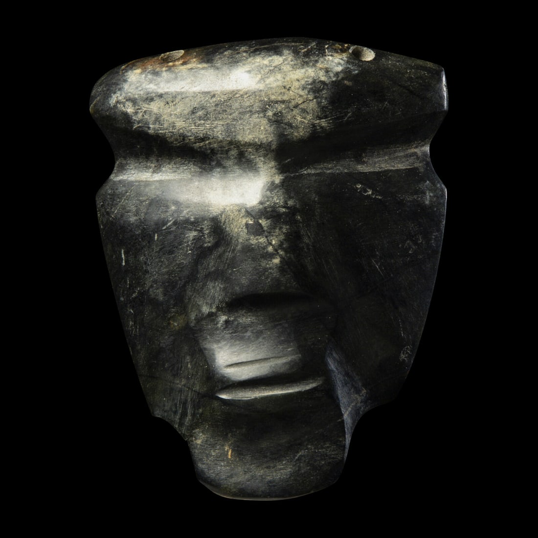 A Mezcala Stone Mask: A Mezcala Stone Mask Circa 300-100 B.C. Height 8.5 cm (3 3/8 inches). Property from a Private Collection, Palm Springs, California This lot is located in Chicago. Provenance: Leonard Ezra Kalina, New 