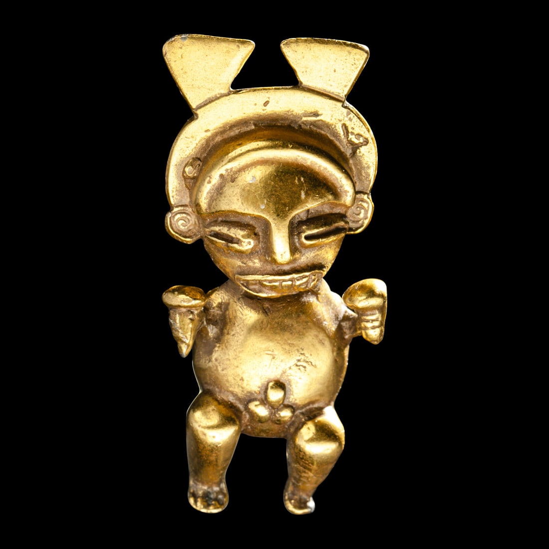 A Quimbya Tumbaga Man: A Quimbya Tumbaga Man Colombia, Circa 1st-7th Century A.D. Height 5 cm (2 inches). Property from a Colorado Collection This lot is located in Chicago. Provenance: Enrique Vargas Alfaro (1915-2008), Sa