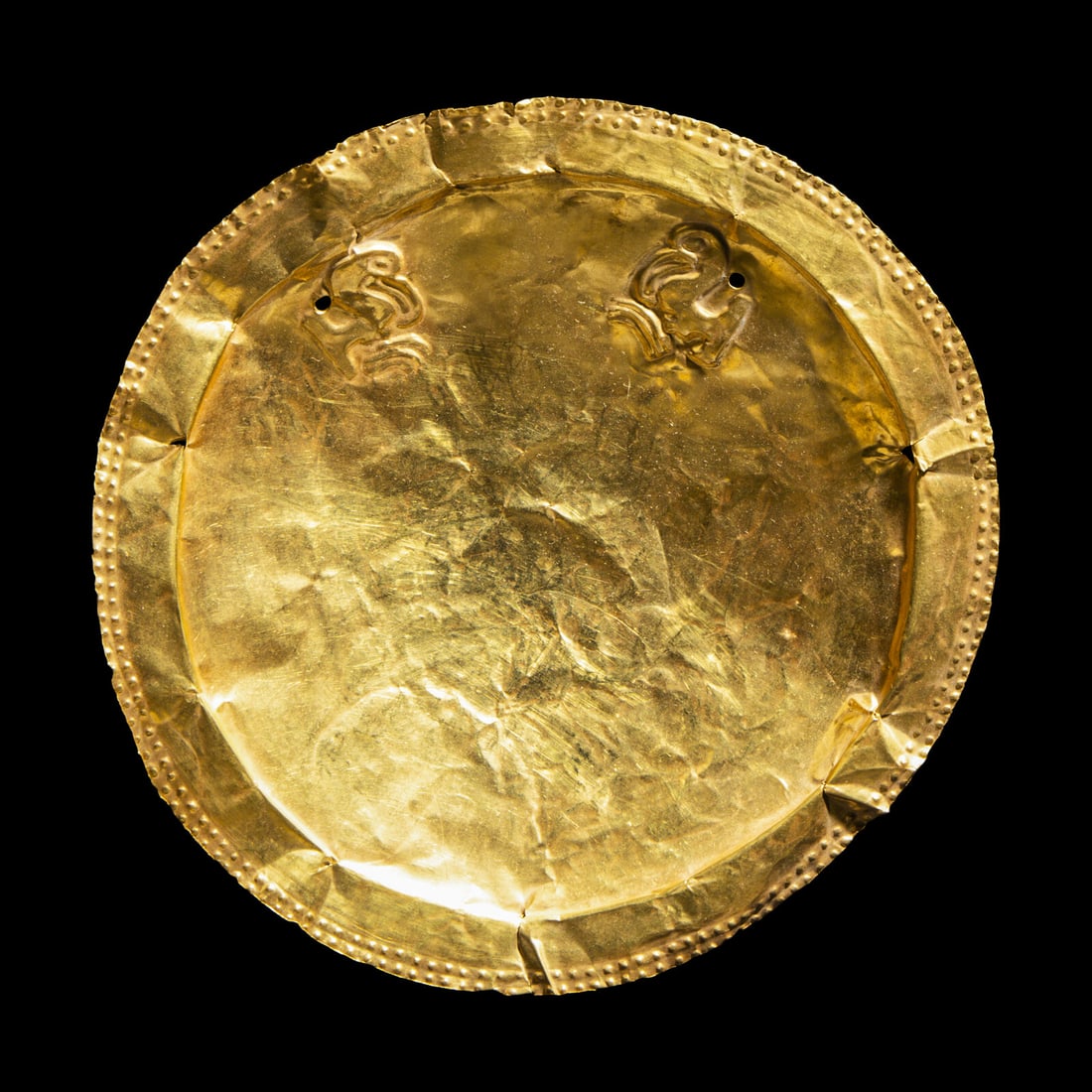 A Panamanian Tumbaga Pectoral Disk: A Panamanian Tumbaga Pectoral Disk Circa 800-1500 A.D. Width 17.2 cm (6 3/4 inches). Property from a Colorado Collection This lot is located in Chicago. Provenance: Enrique Vargas Alfaro (1915-2008), 