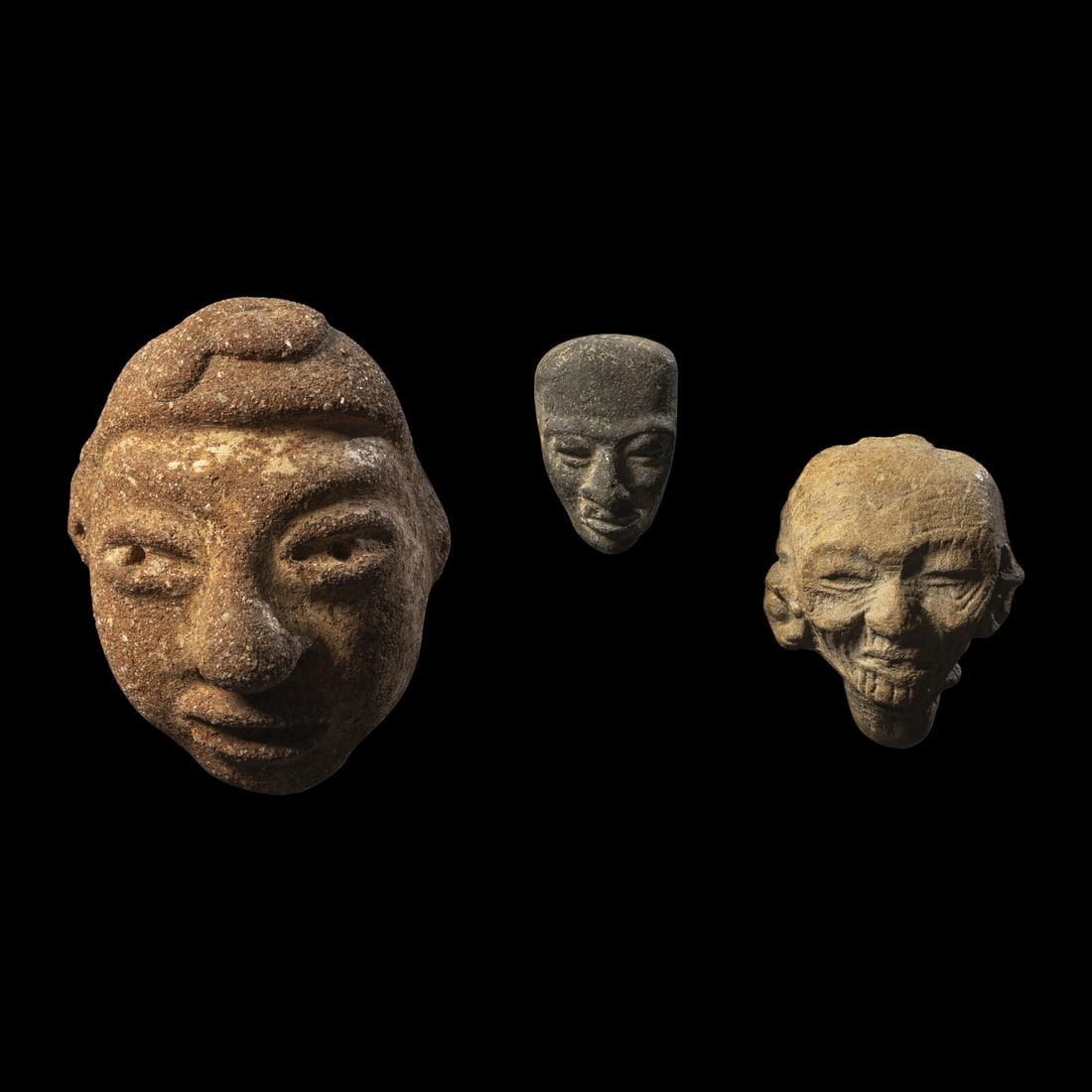 Three Pre-Columbian Stone Heads: Three Pre-Columbian Stone Heads Circa 1st Century B.C.-3rd Century A.D. Height of largest 7.7 cm (3 inches). This lot is located in Chicago. Provenance: Jan Mitchell (former Trustee of the Metropolita