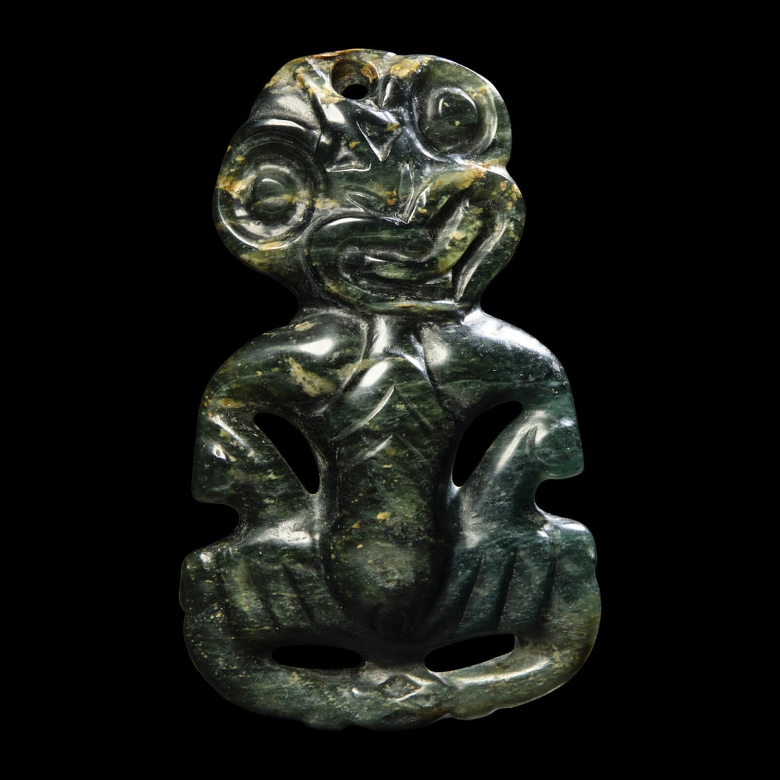 The Guennol Hei Tiki Figure: The Guennol Hei Tiki Figure After the Antique Height 11.2 cm (4 3/8 inches). This lot is located in Chicago. Provenance: Alistair Bradley Martin Collection (1915-2010). Published: Allen Wardwell, "Tri
