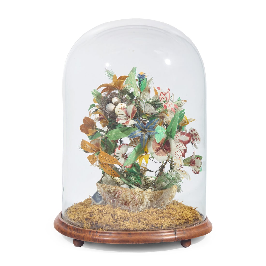 A Victorian Glass-Domed Featherwork Whimsy: A Victorian Glass-Domed Featherwork Whimsy Circa 1840-1850 the feathers worked in the form of an arrangement of flowers in a basket, with artificial conifer sprigs, nest, and eggs, all resting on a wo