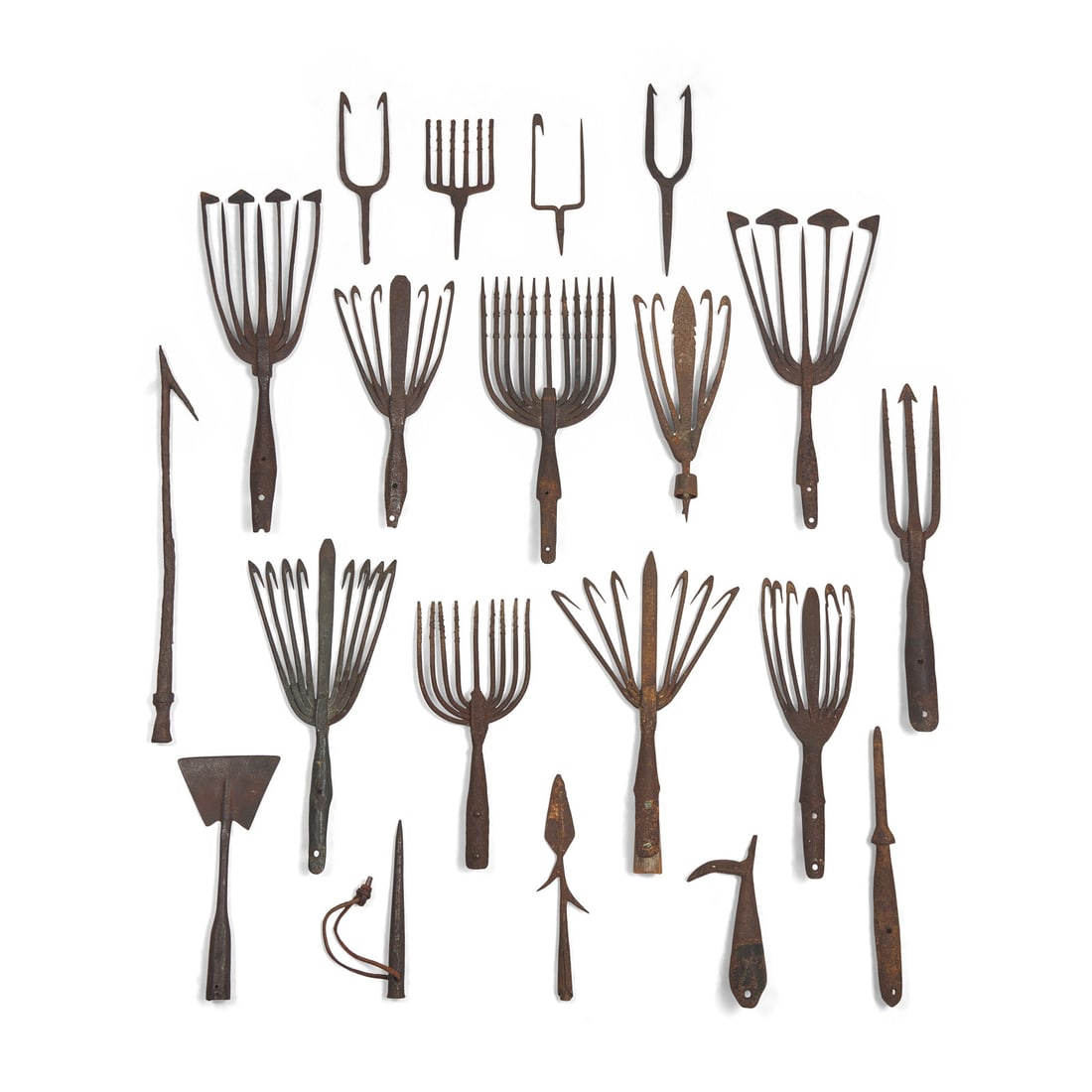 A Collection of Twenty-One Wrought Iron Eel Forks and Whaling Implements (1 of 3)