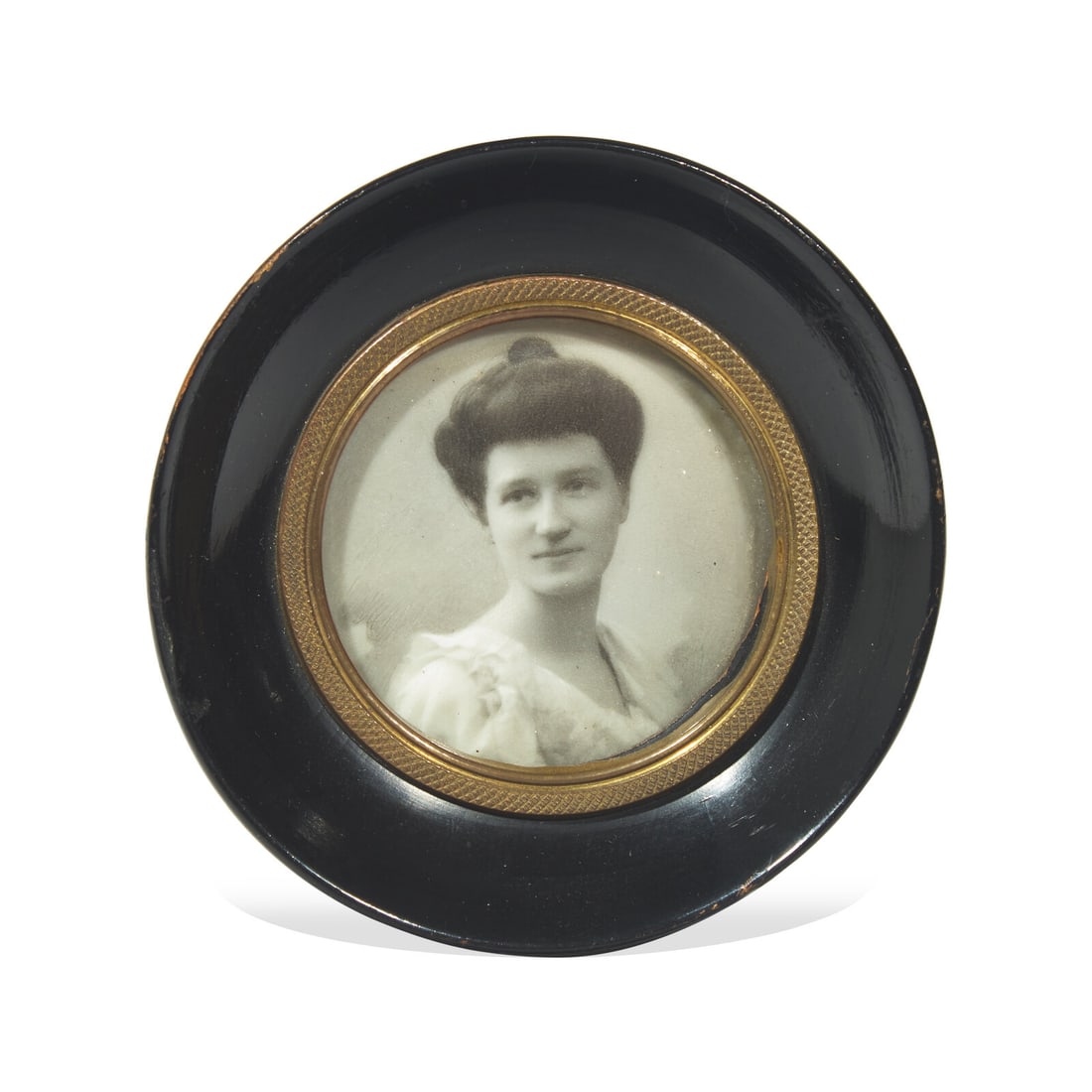 Anglo-American School 19th / 20th Century, A Portrait Miniature of a Lady: Anglo-American School 19th / 20th Century, A Portrait Miniature of a Lady Circa 1900 executed from a photograph or an enhanced photograph, framed. Diameter 2 1/4 inches (sight), diameter 4 inches