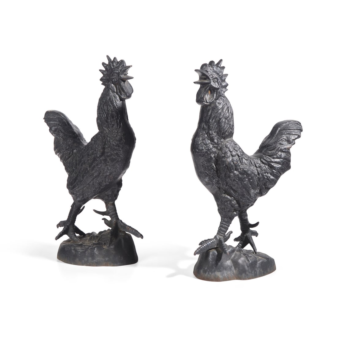 A Pair of Cast Iron Roosters: A Pair of Cast Iron Roosters 20th Century Height 25 1/4 x width 15 x depth 8 inches. Property from Barbara Orenstein Interiors This lot is located in Philadelphia.