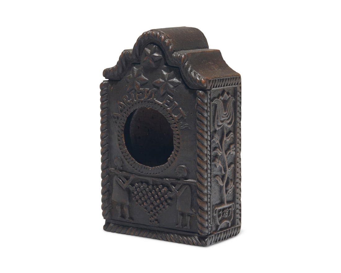 A Continental Carved Walnut Watch Hutch