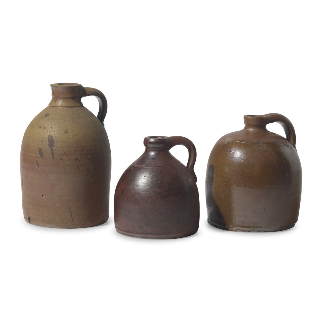 Three Glazed Stoneware Jugs: Three Glazed Stoneware Jugs 19th Century Height 9 x diameter 5 1/2 inches (largest, overall). This lot is located in Philadelphia. Provenance: Paul Charles Ruth (1904-1999), Lehigh Valley, Pennsylvani