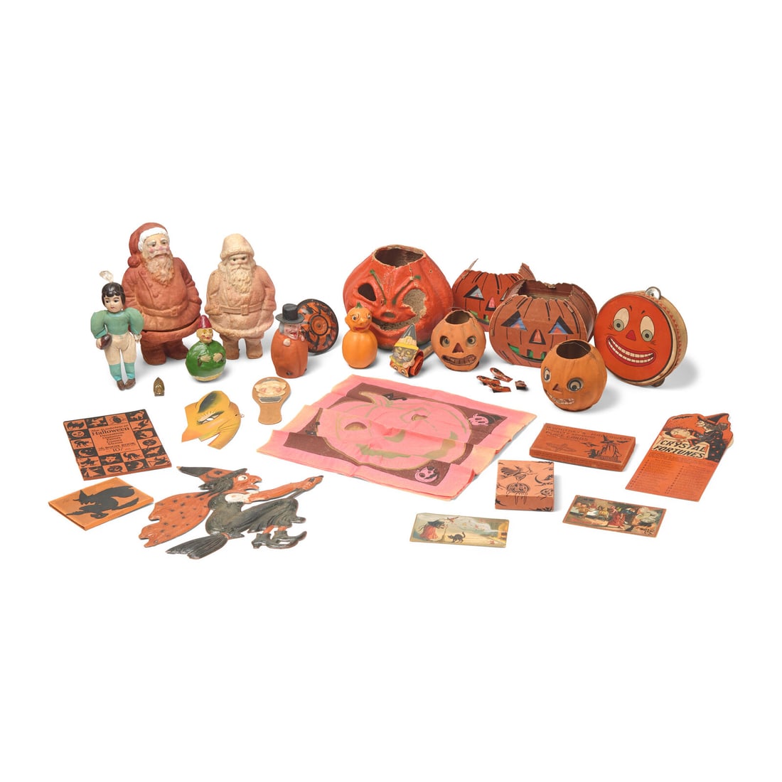 An Assorted Collection of Halloween and Christmas Decorations: An Assorted Collection of Halloween and Christmas Decorations German and American, Mostly Circa 1900-1930 comprising two molded paper Santa figures; a cloth and early plastic Christmas ornament in the