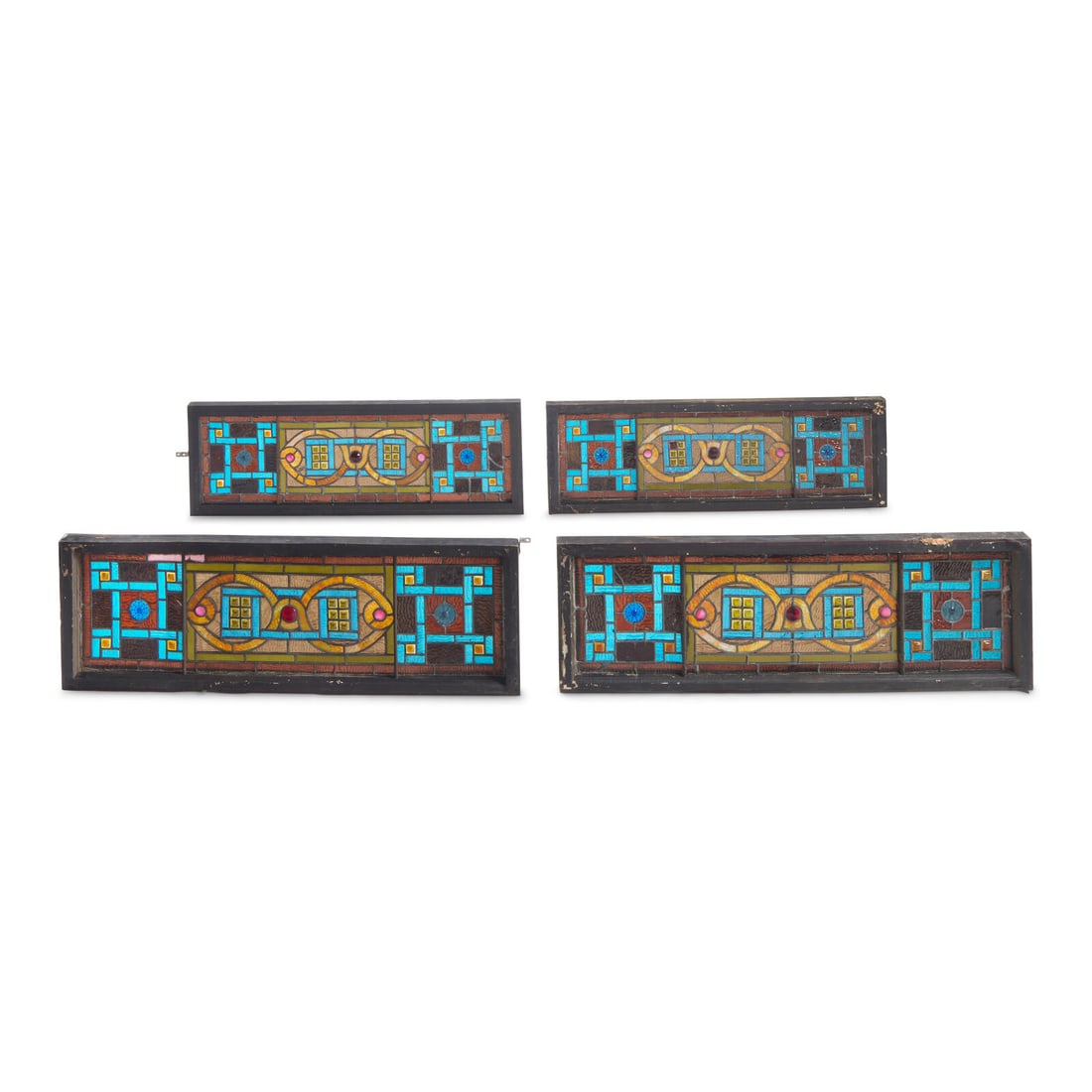 A Group of Four Stained Glass Window Panels: A Group of Four Stained Glass Window Panels Late 19th Century including paste "jewels". 42 3/4 x 14 1/8 inches (each, overall with frames). This lot is located in Philadelphia.