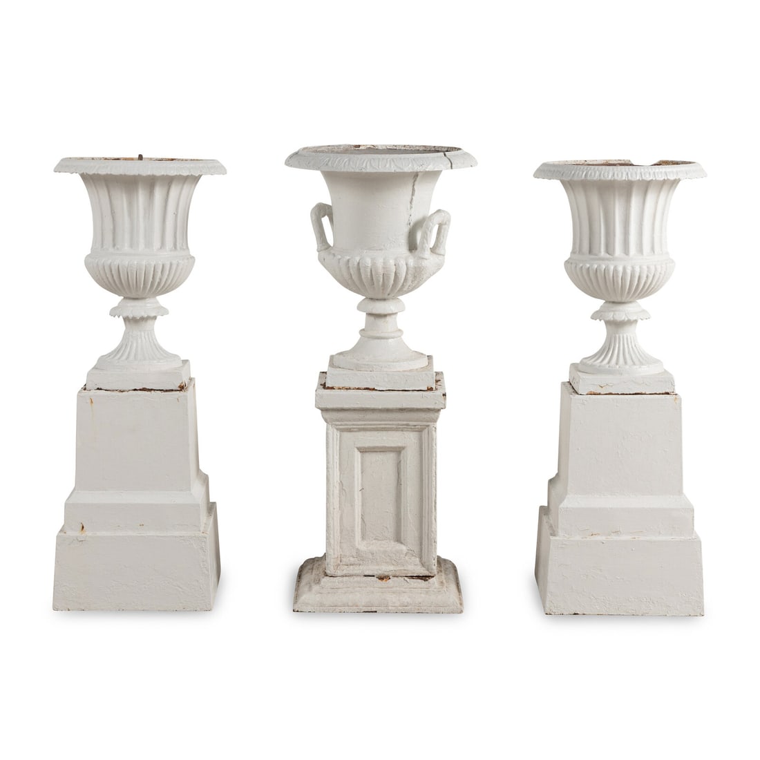 A Set of Three White Painted Iron Garden Urns: A Set of Three White Painted Iron Garden Urns 20th Century Height overall 37 x width 13 x depth 13 inches. This lot is located in Chicago.
