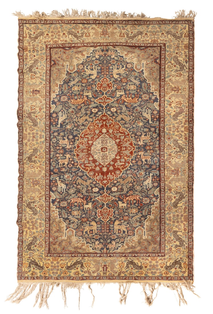 A Persian Wool and Silk Rug: A Persian Wool and Silk Rug Circa 1900 5 feet 11 inches x 4 feet 2 inches. This lot is located in Chicago.