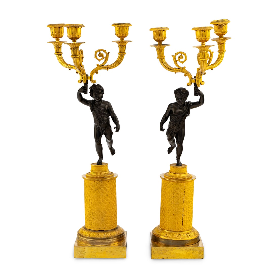 A Pair of French Gilt and Patinated Bronze Three-Light Candleabra: A Pair of French Gilt and Patinated Bronze Three-Light Candleabra Late 19th Century Height 18 1/2 x width 7 inches. This lot is located in Chicago. Provenance: Bonhams, Los Angeles, The Elegant Home,