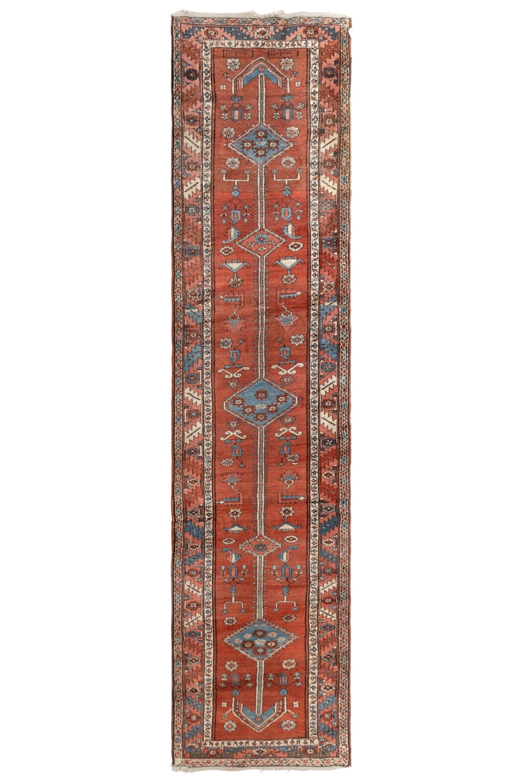 A Karaje Runner: A Karaje Runner Mid 20th Century 12 feet 7 inches x 3 feet 2 inches. This lot is located in Chicago.