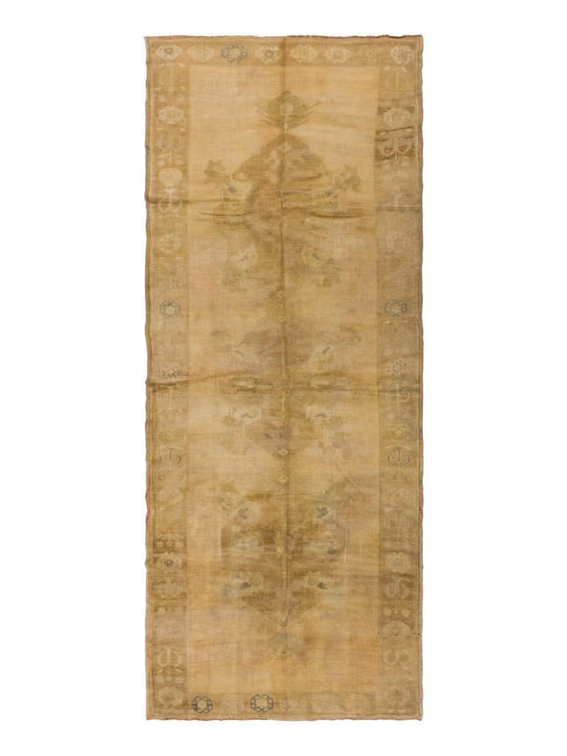 An Oushak Gallery Carpet: An Oushak Gallery Carpet 11 feet 10 inches x 4 feet 11 inches. Property from a Private Family Trust This lot is located in Chicago.
