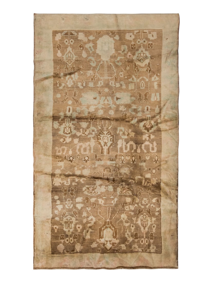 An Oushak Carpet: An Oushak Carpet 7 feet 8 inches x 4 feet 2 inches. Property from a Private Family Trust This lot is located in Chicago.