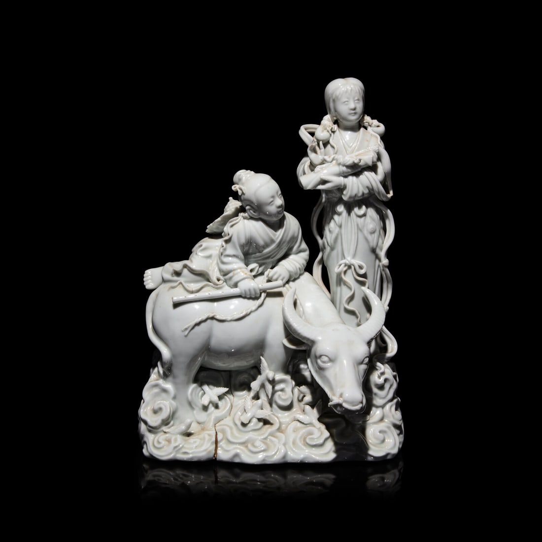 A Chinese Blanc de Chine Figural Group of the Weaver Girl and Herd Boy: A Chinese Blanc de Chine Figural Group of the Weaver Girl and Herd Boy 20th Century Height 11 3/4 x width 8 x depth 7 inches. This lot is located in Chicago.