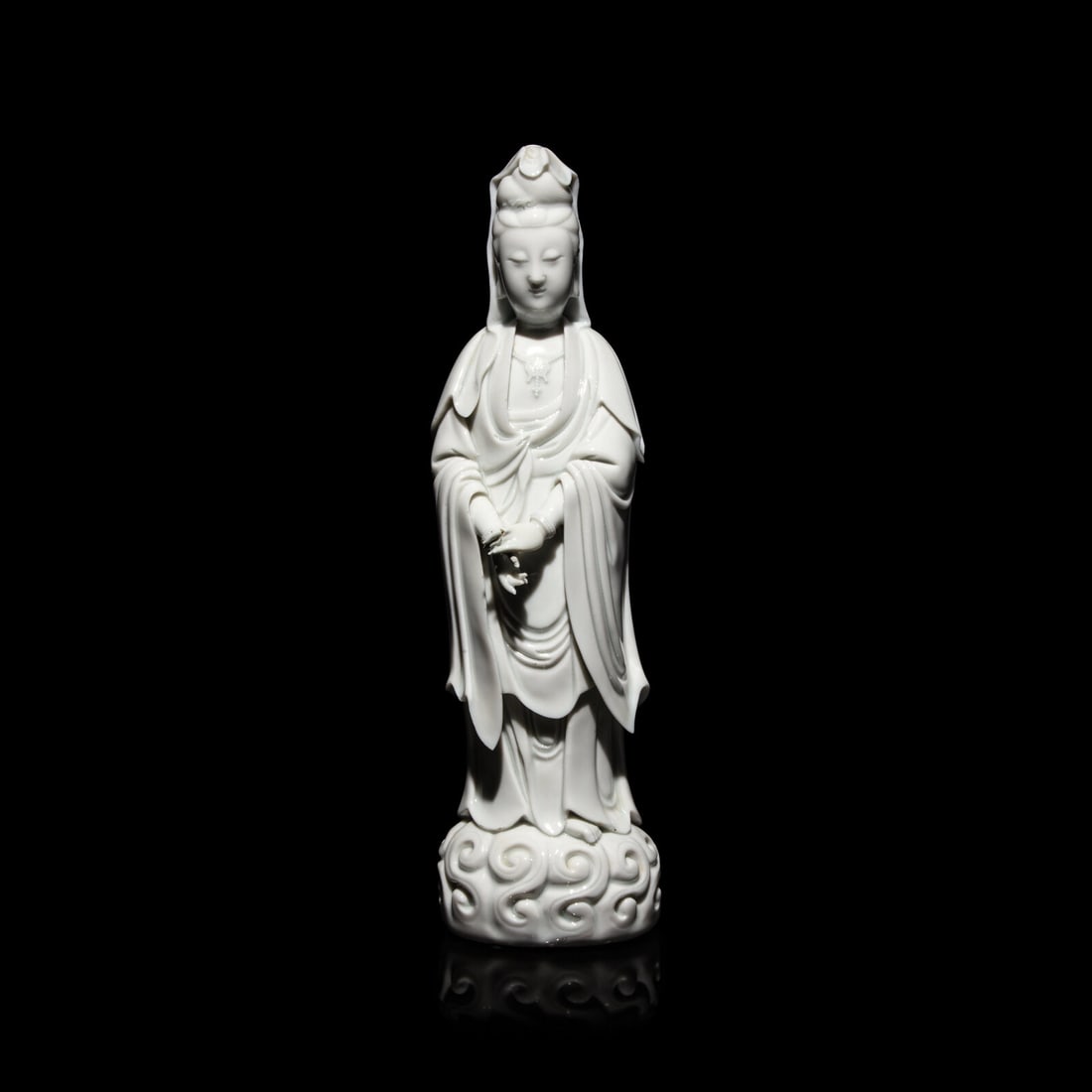 A Chinese Blanc de Chine Figure of Guanyin: A Chinese Blanc de Chine Figure of Guanyin 20th Century Height 16 1/2 x width 4 1/2 x depth 4 1/2 inches. This lot is located in Chicago.