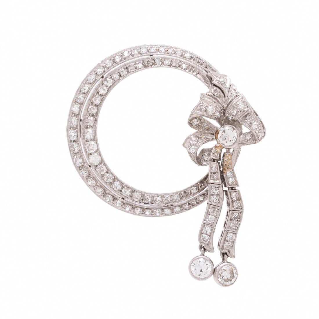 Diamond and Platinum Circle Brooch with Articulated Bow: Diamond and Platinum Circle Brooch with Articulated Bow Single and transitional cut diamonds weighing approximately 1.60 carats total. Platinum. 1 1/2 x 1 1/4 inches. Gross weight: 6.05 dwt. From the