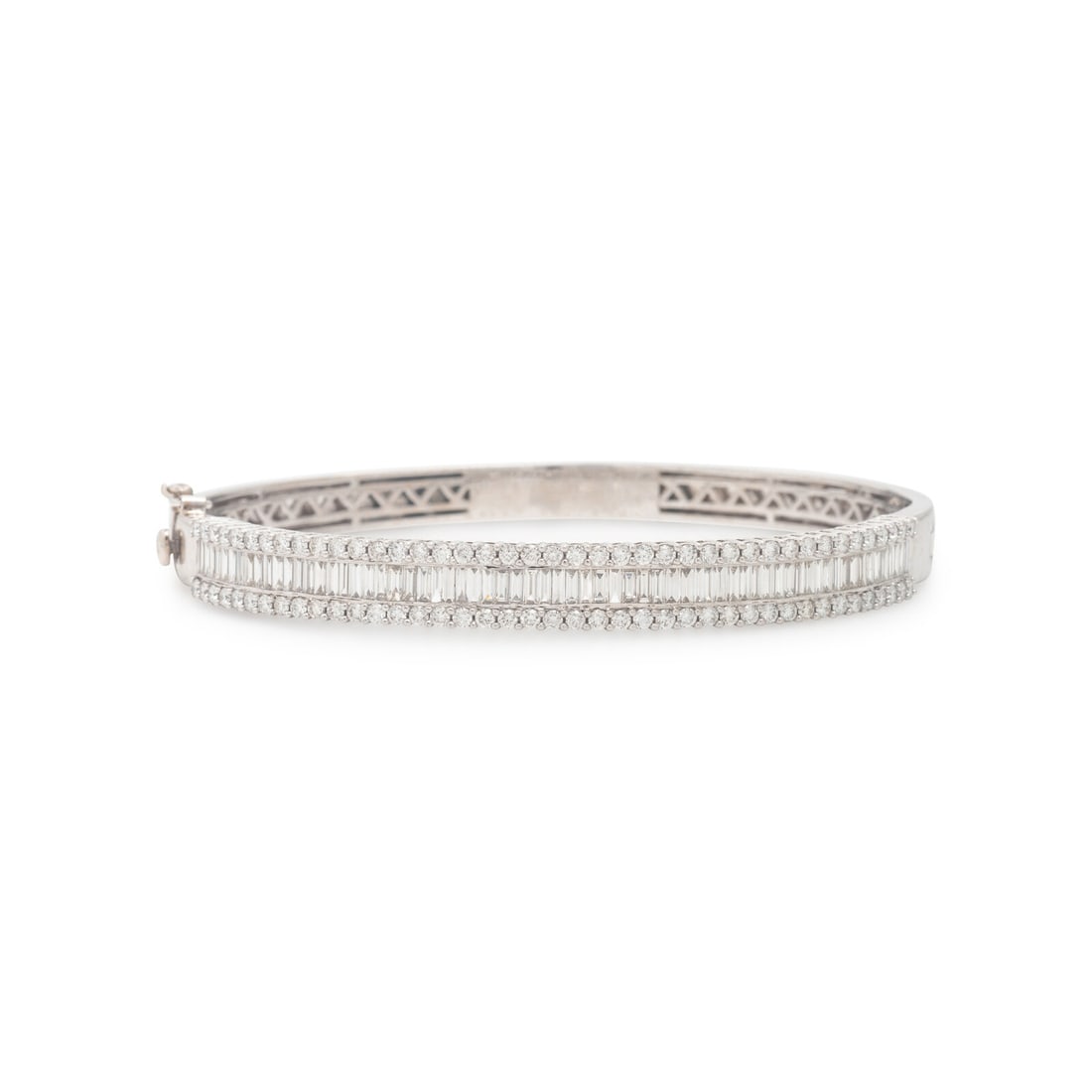 Diamond and White Gold Bangle Bracelet: Diamond and White Gold Bangle Bracelet Baguette and round brilliant cut diamonds weighing approximately 3.48 carats total, hinged with side clasp. 18 karat white gold. 7 1/8 inches inner circumference