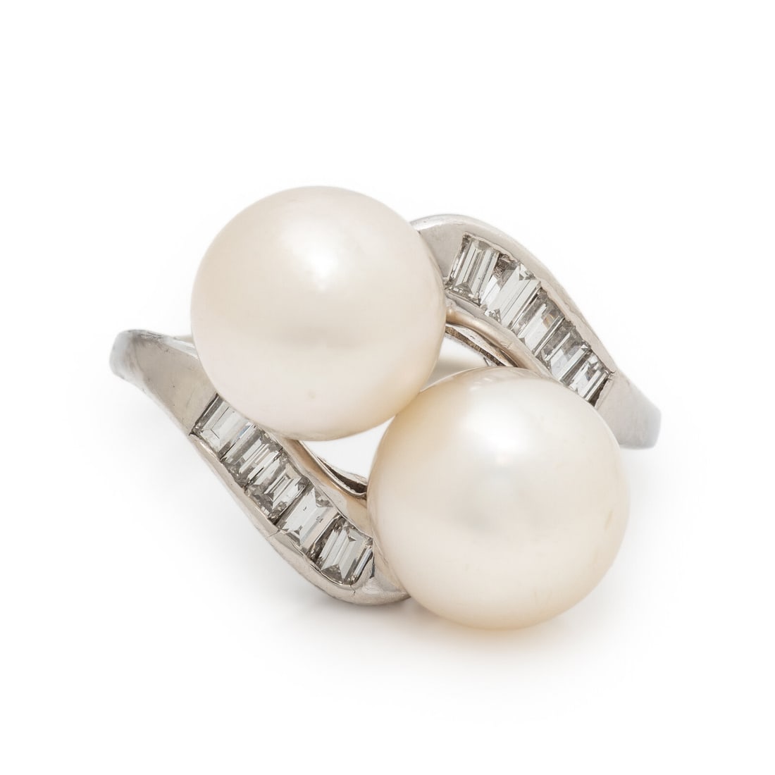 Cultured Pearl and Diamond Ring: Cultured Pearl and Diamond Ring Two cultured pearls, measuring approximately 8.70 mm and 8.90 mm, and baguette cut diamonds. White gold. Ring size 6 1/2. Gross weight: 3.95 dwt. The Property of an Eva