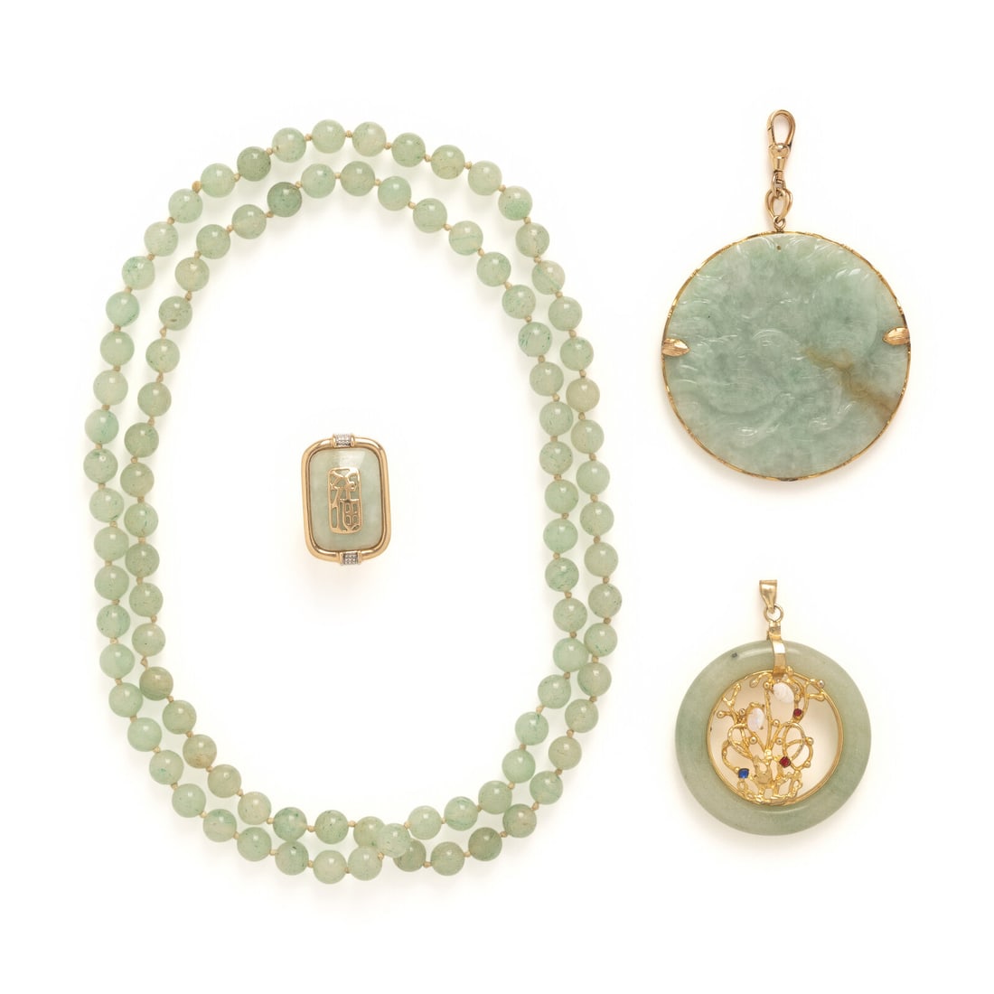 Collection of Jade and Gemstone Jewelry: Collection of Jade and Gemstone Jewelry Including a large carved jade pendant, a pendant with oval opals and round colored glass, a ring with a jade plaque, and a necklace with aventurine quartz beads