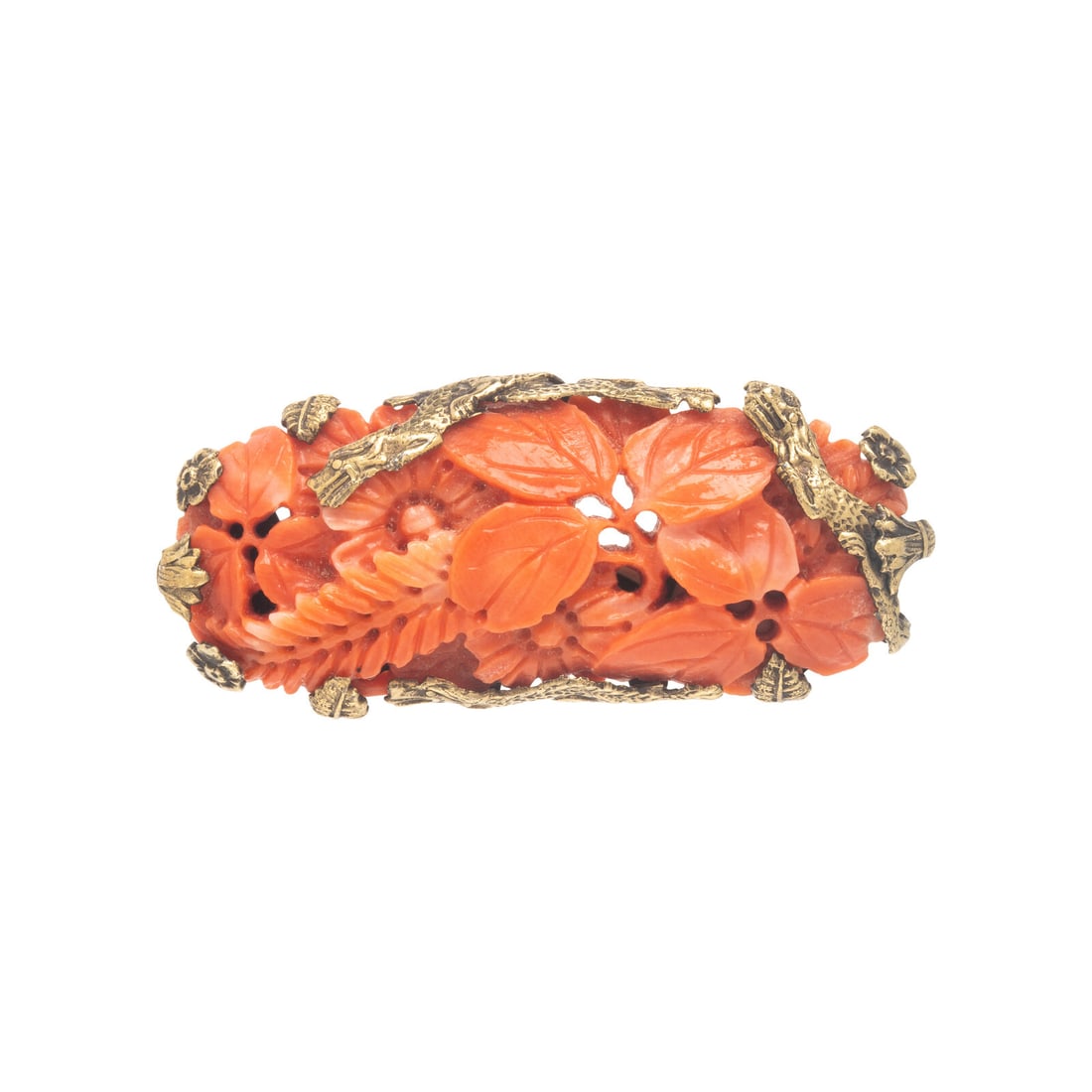 Coral and Yellow Gold Brooch: Coral and Yellow Gold Brooch Carved and pierced coral. 14 karat yellow gold. 1 3/4 x 5/8 inches. Stamp: 14K (maker's mark). Gross weight: 6.65 dwt. This lot is located in Chicago.