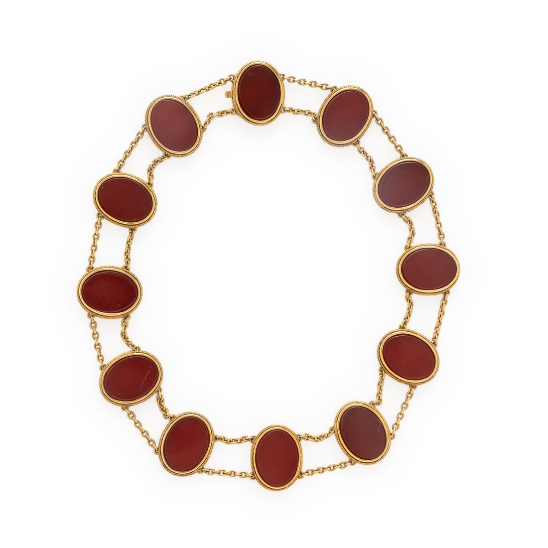 Carnelian and Yellow Gold Necklace: Carnelian and Yellow Gold Necklace Oval carnelian plaques measuring approximately 20.00 x 15.00 mm. Yellow gold. 15 3/4 inches long. Stamp: ORR 22. Gross weight: 53.85 dwt. Estate of a Chicago