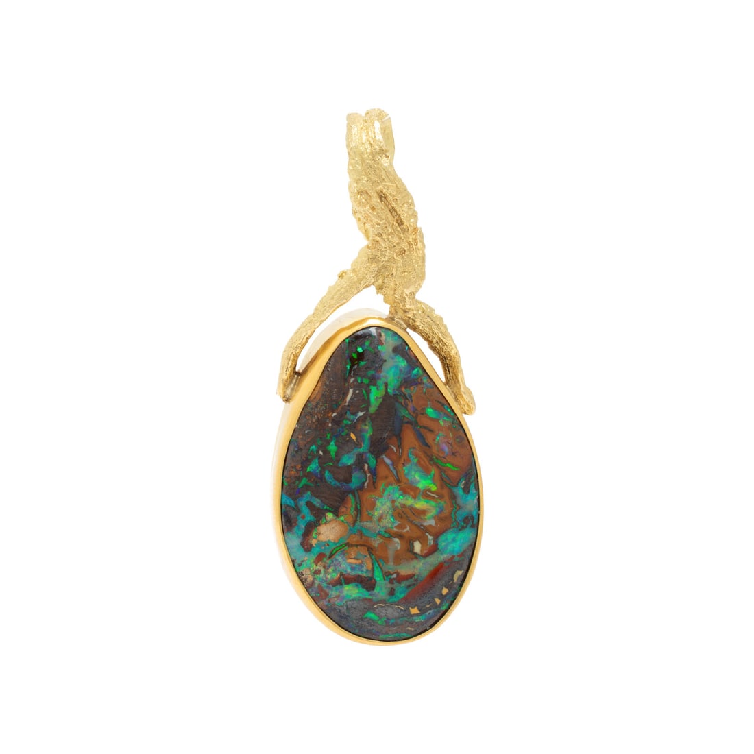 Yellow Gold and Boulder Opal Pendant: Yellow Gold and Boulder Opal Pendant Pear shape boulder opal measuring approximately 24.50 x 15.50 mm. 14 karat yellow gold. 1 5/8 x 5/8 inches. Stamp: 14K. Gross weight: 5.35 dwt. Property from a