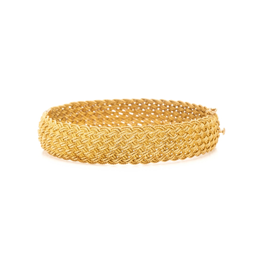 Yellow Gold Bangle Bracelet: Yellow Gold Bangle Bracelet In a woven design. 19 karat yellow gold. 7 inches inner circumference. Stamp: 19Kt. Gross weight: 23.55 dwt. Property of a Lady, Boulder, Colorado This lot is located in Ch