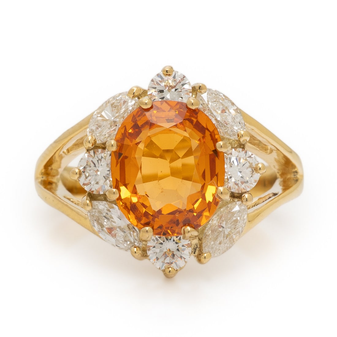 Spessartine Garnet, Diamond, and Yellow Gold Ring: Spessartine Garnet, Diamond, and Yellow Gold Ring Oval spessartine garnet weighing approximately 2.75 carats by formula, and marquise and round brilliant cut diamonds weighing approximately 0.95 carat