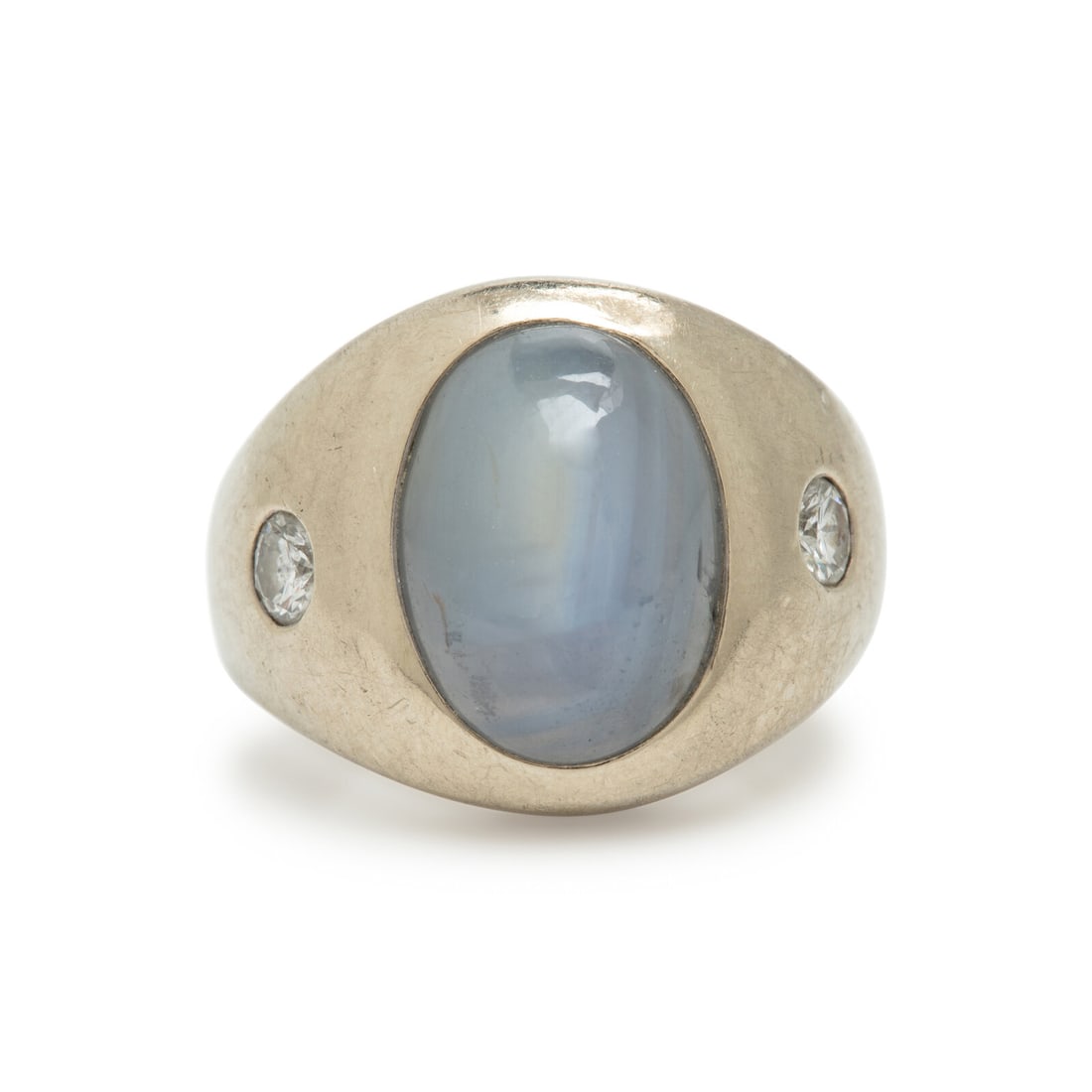 Star Sapphire and White Gold Ring: Star Sapphire and White Gold Ring Oval cabochon star sapphire weighing approximately 11.80 carats by formula, and round brilliant cut diamonds. White gold. Ring size 4 3/4. Gross weight: 9.80 dwt.