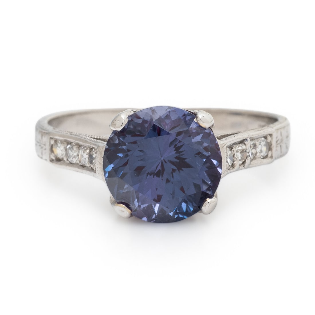 Synthetic Alexandrite, Diamond, and Platinum Ring: Synthetic Alexandrite, Diamond, and Platinum Ring Round synthetic alexandrite weighing approximately 2.60 carats by formula, and single cut diamonds weighing approximately 0.15 carat total. Platinum.