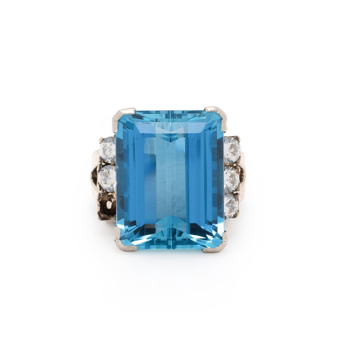 Aquamarine and Silver Ring: Aquamarine and Silver Ring Emerald cut aquamarine weighing approximately 15.00 carats by formula and round cubic zirconia. Silver. Ring size 7. Stamp: LCPT. Gross weight: 8.20 dwt. Property from a